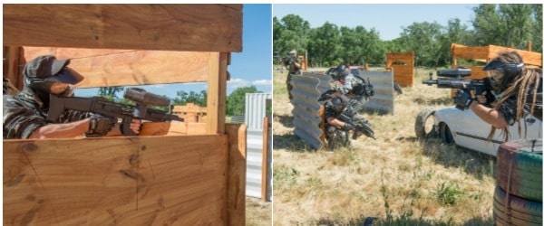 Partida de Paintball donde los participantes están escondidos en diferentes obstáculos