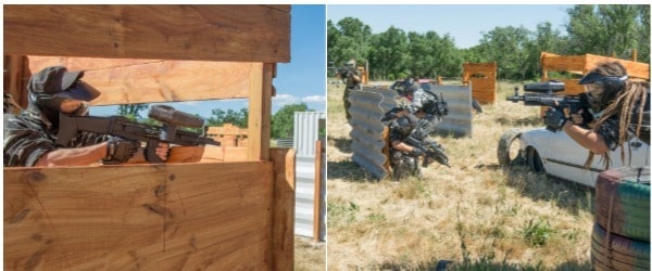 Partida de Paintball donde los participantes están escondidos en diferentes obstáculos